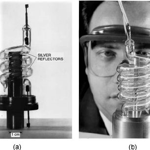͑ a ͒ Theodore Maiman’s first laser, removed from aluminum cylinder used during operation, and ͑ b ͒ photo of Maiman behind a larger ruby laser, handed out at the Hughes press conference announcing the laser.