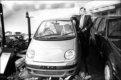 Managing Director of Matiz cars, SG Awasthi poses with the new car 'Matiz' introduced by Daewoo motors, a South Korean automotive company