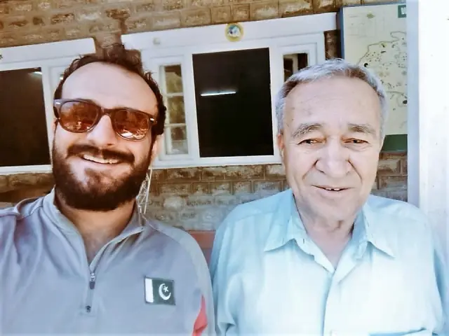 Ashraf Aman poses for a selfie with a person.