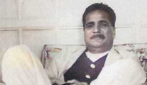 A Great Poet and Philosopher of Muslims Thinker style of sitting at couch