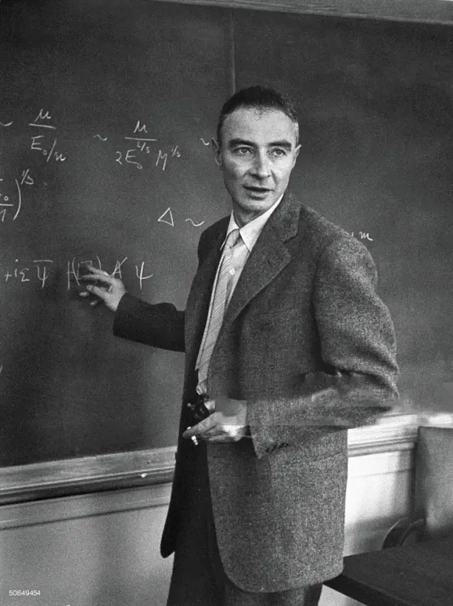J. Robert Oppenheimer working out physics equations on the blackboard