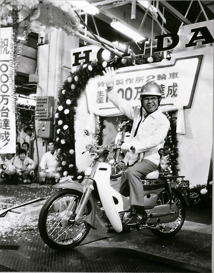 Founder, Soichiro Honda on a Super Cub (at Memorial Ceremony in 1971 of cumulative production of motorcycles reached 10 million unit milestone at Suzuka Factory)